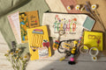 Collection of teacher-themed stationery items including a pouch, notebooks, and keychain.