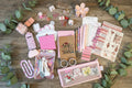 Collection of stationery items including clips, notebooks, and decorative papers.