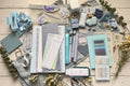 Collection of stationery items including pens, paper, and decorative objects.